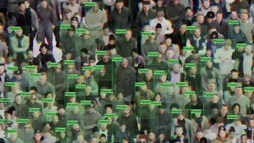 A visual representation of machine learning. A computer vision algorithm that analyzes a crowd using labeled green and purple frames.