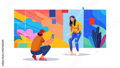 Woman posing for photo shoot by friend with smartphone in front of colorful artistic mural backdrop