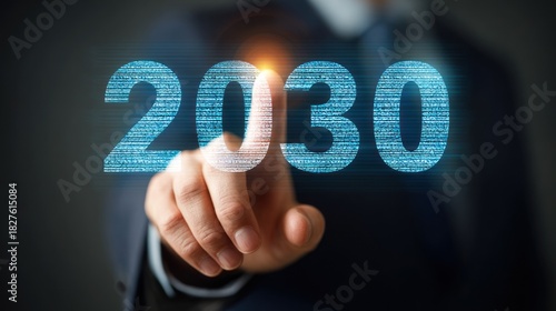 Businessman touching 2030 digital screen, future technology concept.