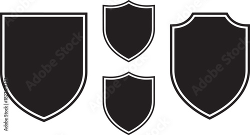 Four black shield shapes with white outlines on a white background Keywords: shield, emblem, badge