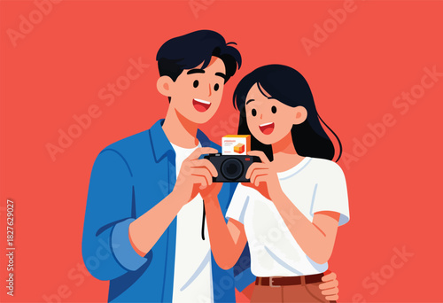 A cheerful couple, with dark hair, smiles while looking at a camera, with a small box above