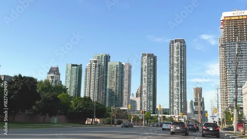 Rush hour traffic scene in Mississauga with vehicles navigating city streets and intersections