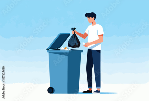 A person in casual attire is throwing trash into a bin under a light blue sky