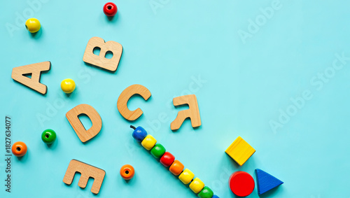 Colorful learning toys arranged on a blue surface for early childhood education and playtime activities
