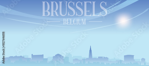 Blue panoramic poster of the city skyline with misty background buildings and clouds of BRUSSELS, BELGIUM