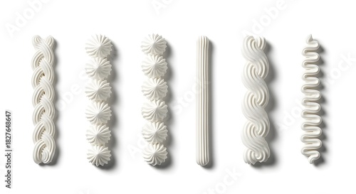 Six different styles of white dessert frosting borders and piping isolated on white background