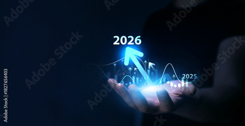 Business person draws increase arrow graph corporate future growth year 2025 to 2026.Business plan for increase in 2026 year.Development to success and motivation in new year 2026.