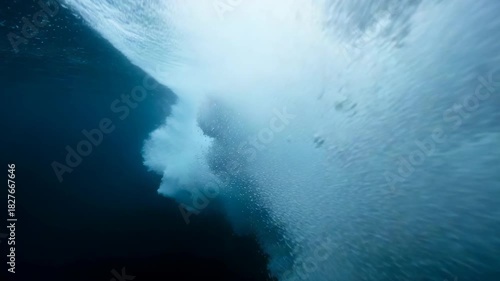 Underwater View of a Powerful Ocean Wave in Deep Blue Water