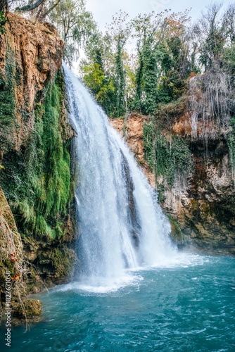 Tall Waterfall Plunging into Turquoise Pool in Monasterio de Piedra Park