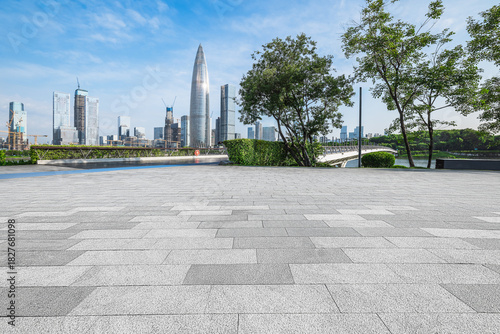 Empty square floor and modern city skyline with skyscrapers.