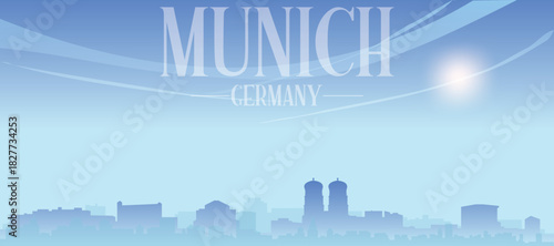 Blue panoramic poster of the city skyline with misty background buildings and clouds of MUNICH, GERMANY