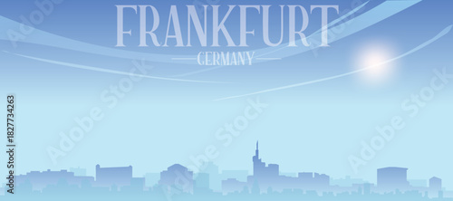Blue panoramic poster of the city skyline with misty background buildings and clouds of FRANKFURT, GERMANY