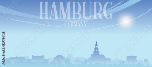 Blue panoramic poster of the city skyline with misty background buildings and clouds of HAMBURG, GERMANY