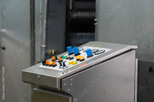 Control panel of an industrial machine in close up view.