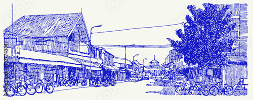 A blue and white drawing of a street with a building and a tree. There are several bicycles parked on the street. vector illustration