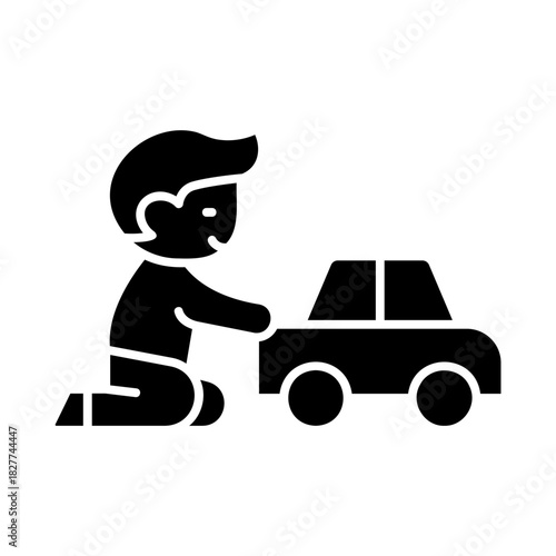 Child playing with toy car