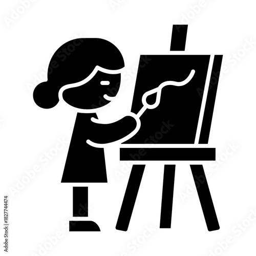 Kid painting on easel