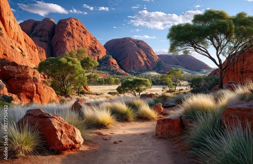 the iconic rock formations at avonite in australia, featuring three large red rocks standing side by side against a clear blue sky.
