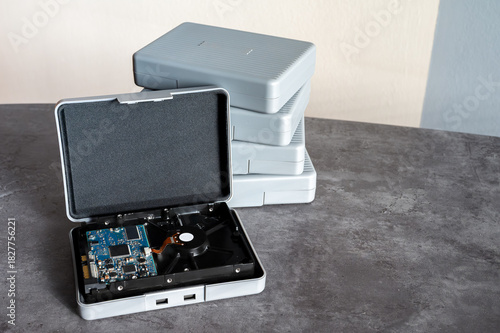 Open protective case with hard disk drive inside, digital data storage concept