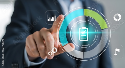 A businessman in a dark suit touches a futuristic holographic interface displaying a circular chart with progress indicators and various icons, symbolizing data analysis and strategy