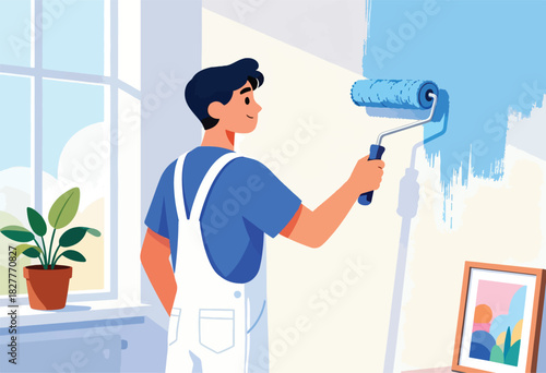 A person in overalls paints a wall blue with a roller. There's a plant, window, and artwork