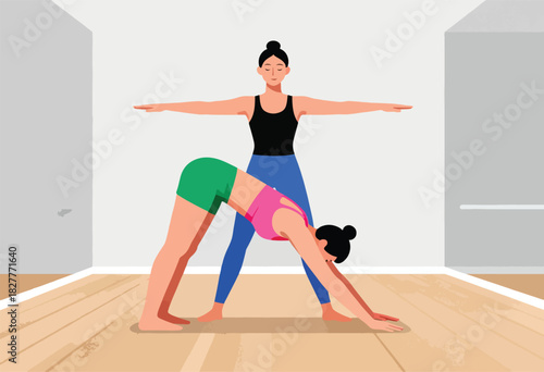 Two women practice yoga in a studio. One woman assists another with a downward-facing dog pose. Room design is simple