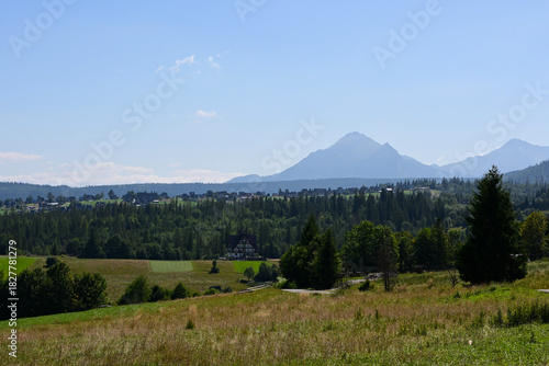 Fototapeta Naklejka Na Ścianę i Meble -  Fantastic view of the Tatra Mountains, located off the beaten track. Tatra Mountains viewpoint near Zakopane - Gawlaki Walkosze street, Poland