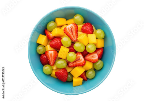 Bild auf Leinwand Isolated healthy fruit salad of ripe mango, strawberries, and grapes in a blue b