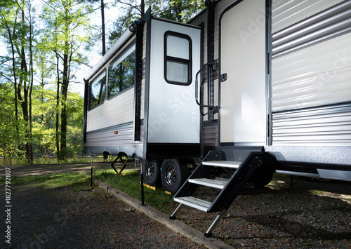 Bright travel trailer with slideout and steps out