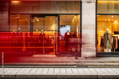 Photos Motion blurred crowd passing historic luxury storefront at golden hour, Regent S