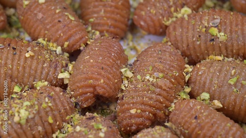 Lebanese recipe for Maakaroun fritters: fine wheat semolina, flour, butter, oil, ground anise. High quality 4k footage