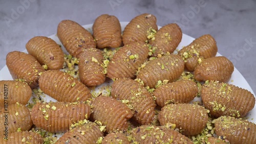 Lebanese recipe for Maakaroun fritters: fine wheat semolina, flour, butter, oil, ground anise. High quality 4k footage