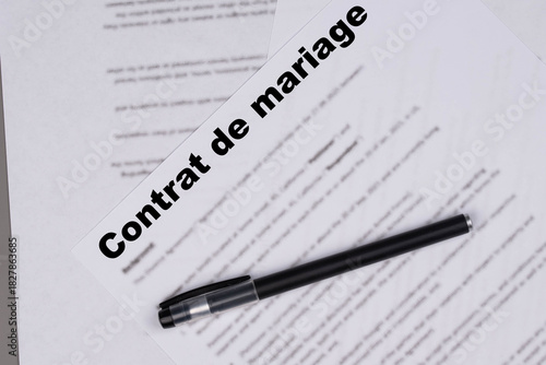 Contrat de mariage in French or Marriage contract, Marital Settlement Separation Divorce Agreement paper document, symbolizing divorce, prenuptial contract, prenup, breakup for France.