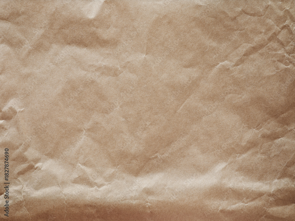 Fototapeta premium Old crumpled paper sheet or parchment texture background. Element for design. Top view.