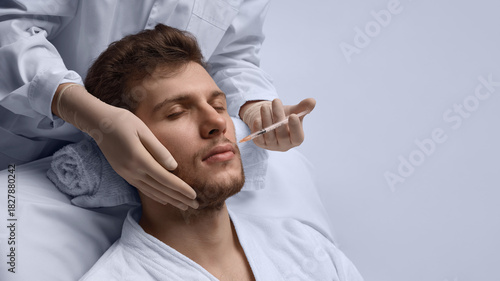 Fotografia Lip contour correction injection enhancing male facial harmony