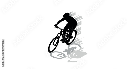 Dynamic silhouette of mountain biker speeding downhill