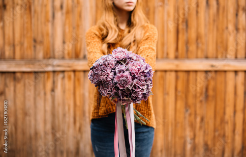 Wallpaper Mural Very nice young woman holding big and beautiful bouquet of fresh flowers in colors Torontodigital.ca