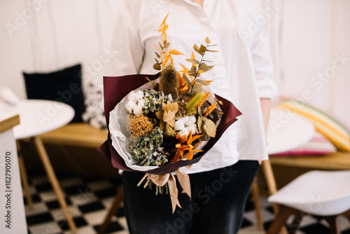 Wallpaper Mural Very nice young woman holding big and beautiful bouquet of fresh flowers in colors Torontodigital.ca