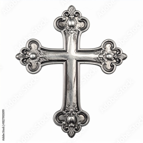 Vintage silver ornate monogram cross as an ornament. Isolated on a white background, showcasing antique detailing.