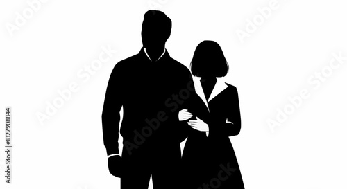 Silhouette of a man and woman standing together arm in arm.