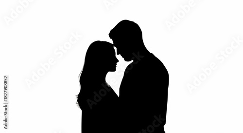Silhouetted couple embracing intimately in a tender moment of love and connection.
