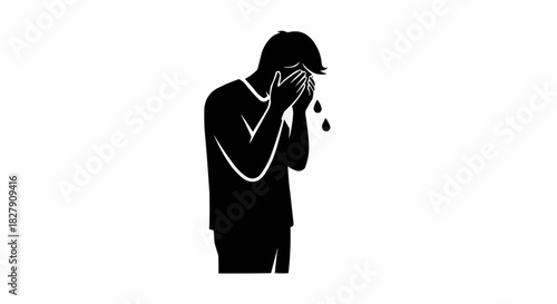 Silhouette of a person crying with hands covering face.