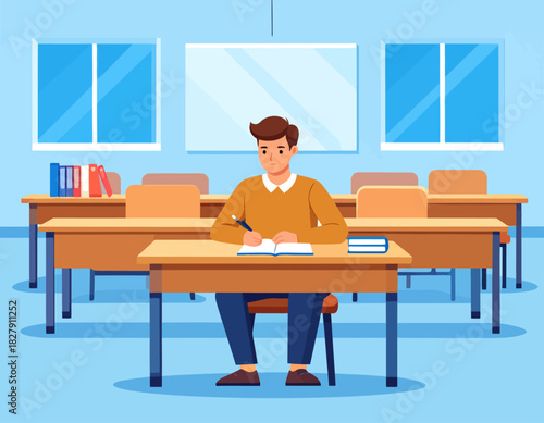 A young man is sitting at a desk in a classroom, writing in a notebook with a pen, with other empty desks and a whiteboard visible.