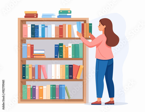 A woman with brown hair is placing a book on a wooden bookshelf filled with colorful books.