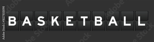 Black color analog flip board with word basketball on gray background