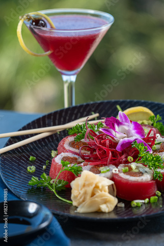 Tuna wrapped sushi roll with berry cocktail.