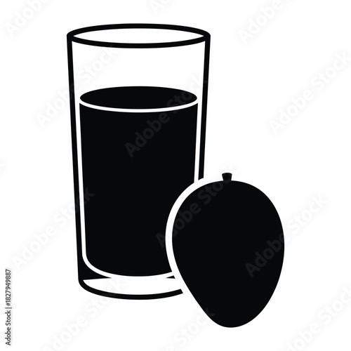 Glass of juice next to a whole mango on white background Keywords: juice, mango, fruit, drink, beverage, glass