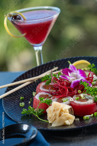 Tuna wrapped sushi roll with berry cocktail.