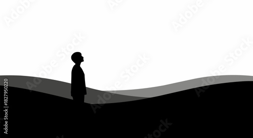 Silhouette of a person standing alone, looking up with a sense of contemplation and hope.
