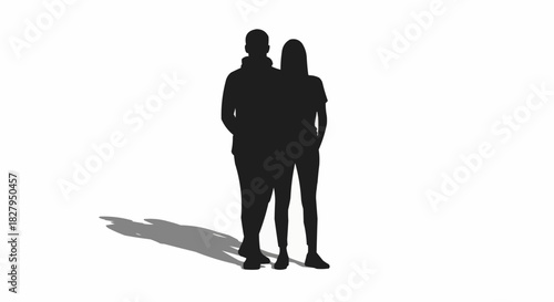 Silhouette of a couple standing together casting a shadow.